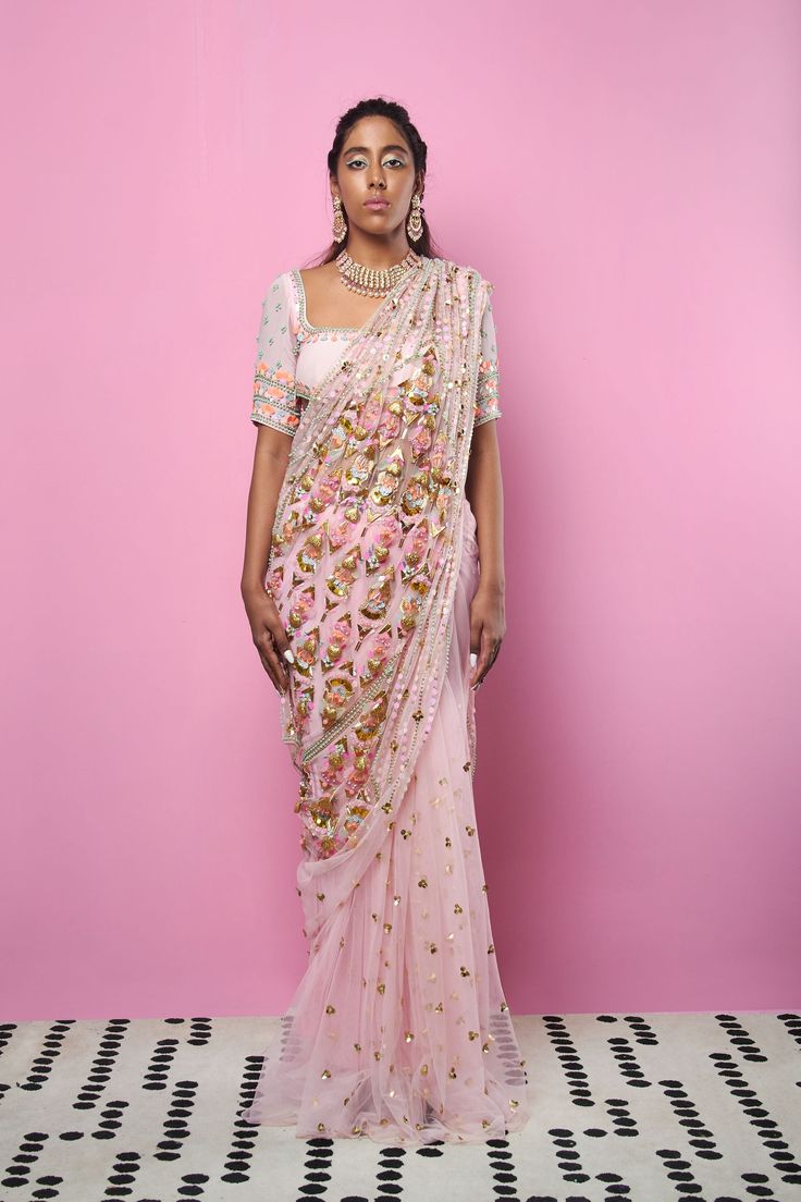 An original Papa Don't Preach silhouette: Blush pre-stitched hip embellished saree and blouse with 3D embroidery sequins pearls, glass beads, metal hearts, and accents.From Papa Don’t Preach’s Zsa Zsa Zsu collection. DELIVERY TIMEPlease allow 8-12 weeks for your outfit to arrive. FABRIC DETAILSTulle, Georgette, Crepe. Professional cleaning only. Bollywood Style Embellished Festive Pre-draped Saree, Bollywood Style Hand Embellished Blouse Piece For Reception, Hand Embellished Bollywood Blouse Piece For Reception, Traditional Hand Embellished Pre-draped Saree For Diwali, Party Traditional Wear With Pearl Embroidery, Traditional Pre-draped Saree With Pearl Embroidery For Party, Hand Embellished Blouse Piece For Wedding Saree, Traditional Georgette Pre-draped Saree With Pearl Embroidery, Hand Embellished Saree Blouse Piece For Wedding