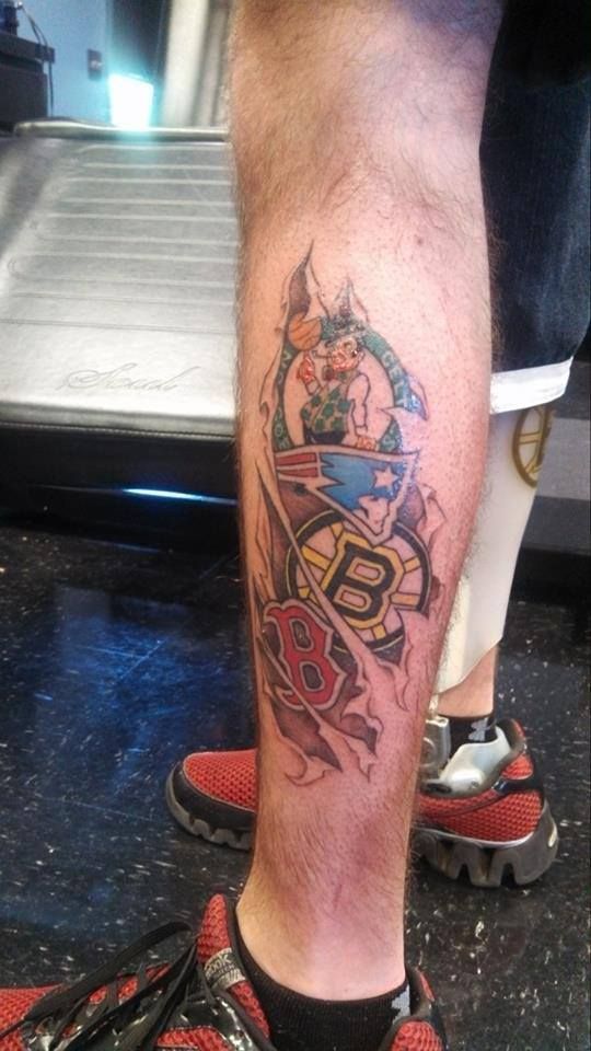 a man with a tattoo on his leg