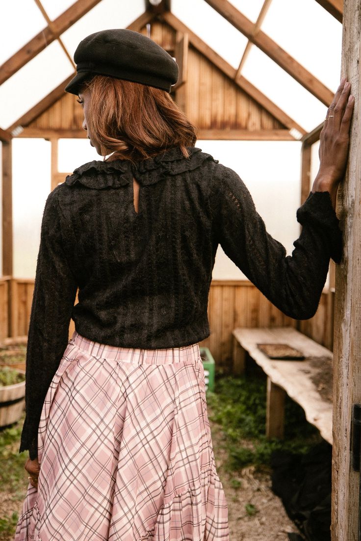 Our Shiloh Top is back in BLACK - the perfect combination of style and comfort! Made of black lace fabric, this women's top features a scoop neckline with delicate ruffle detailing and long fitted sleeves with ruffle cuffs. The pull-over style and back keyhole button make it easy to wear, while the lined bodice and stretch fabric add a touch of luxury. Perfect for fall! Black Tops With Lace Cuffs For Spring, Black Blouse With Lace Cuffs For Spring, Black Fitted Lace Top With Ruffles, Black Lace Cuffs Blouse For Fall, Black Blouse With Lace Cuffs For Fall, Fitted Black Lace Top With Ruffles, Fitted Lace Top With Ruffles For Fall, Chic Black Lace Top With Ruffles, Lace Top With Ruffled Collar For Fall