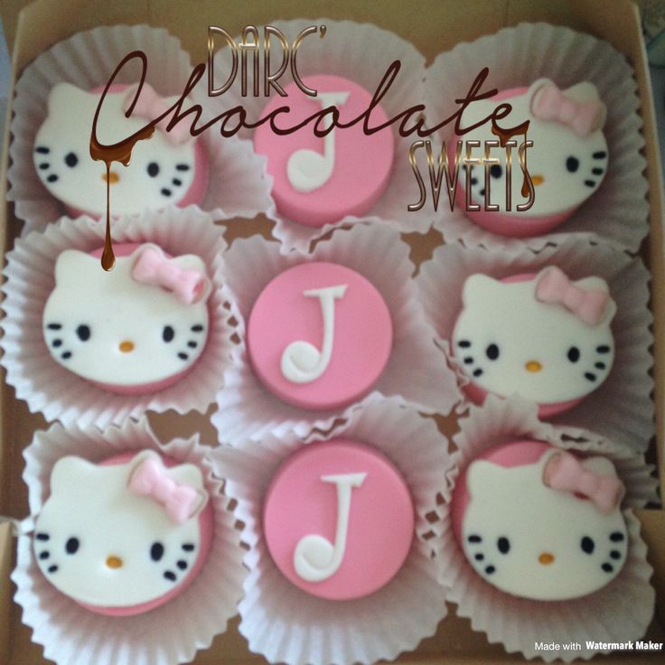 hello kitty cupcakes with pink icing in a box