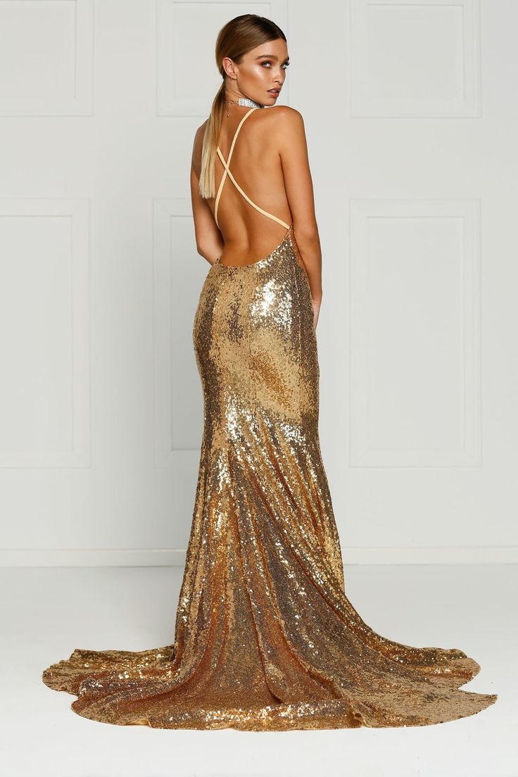 The Gigi Gown is a stunning mermaid fit dress with a v-neck and lace up back. The sequinned material is stretchy and it is lined to the hem. There is a hidden zipper on the back. What is a Made-To-Order? This product is a made-to-order item. Made-to-order items are not held in physical stock and production commences AFTER order placement. We try to limit production and stock levels and as such, made-to-order items produce less waste and allow you to purchase your dream gown without the chance of Prom Dresses Long Blue Royals, Formal Dresses Knee Length, Gold Sequins Dress, Prom Dresses Gold, Formal Dresses Mermaid, Metallic Dresses, Sparkly Dresses, Mermaid Fit, Dream Gown