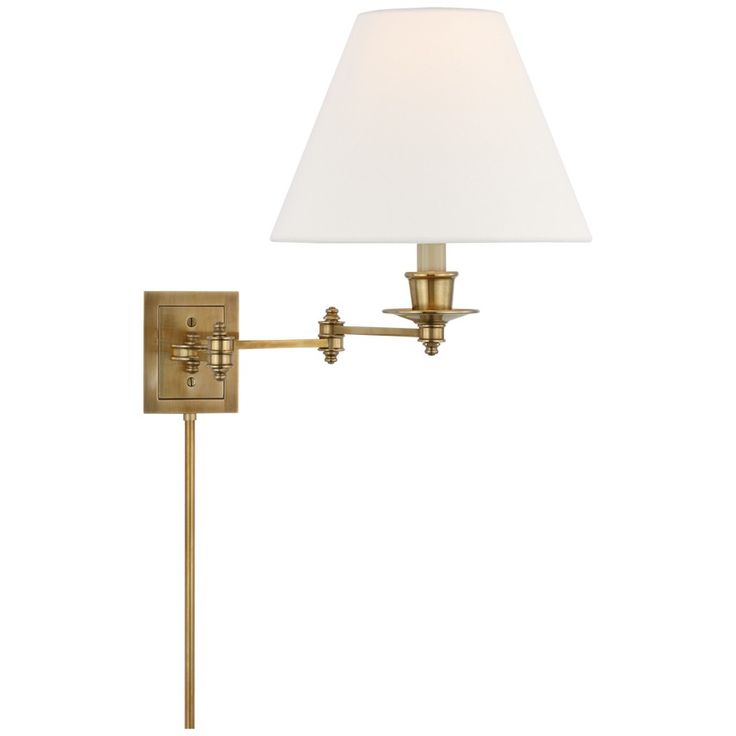 a wall light with a white shade on the side and a metal pole attached to it