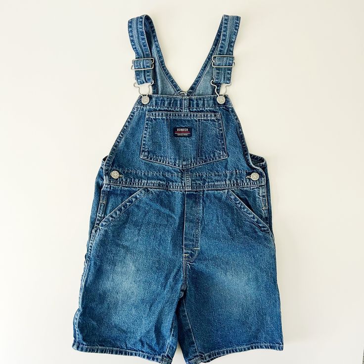 Retro denim shorts overalls from OshKosh. Good used condition with some expected wear. Size 7 -- please see measurements (29" length fully extended, 6.5" inseam, further measurements available upon request). 100% cotton. Retro Denim Shorts, Oshkosh Overalls, Shorts Overalls, Overall Shorts, Denim Shorts, Overalls, Rompers, Size 7, How To Wear