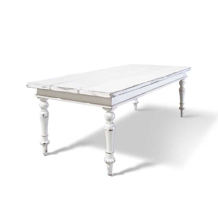 a white coffee table with two legs and a top that has been turned into a bench