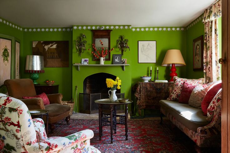 a living room filled with furniture and a fire place