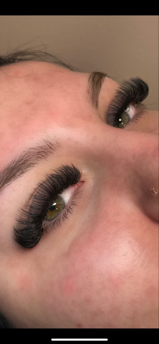 Dark and fluffy mega volume eyelash extensions on girl with green eyes Heavy Lash Extensions, Medium Length Volume Lash Extensions, Textured Volume Lash Extensions, Dramatic Hybrid Lash Extensions, Mega Full Lash Extensions, Lashes Full Volume, D Curl Lash Extensions Volume, Eyelash Extensions Long And Full, Lash Extensions Green Eyes