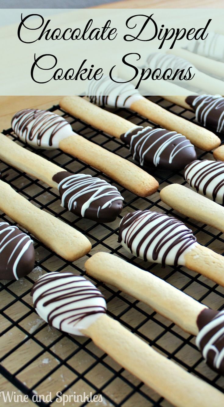 chocolate dipped cookie spoons on a cooling rack