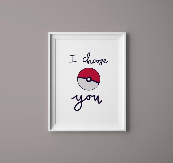 a framed poster with the words i choose you and a pokeball on it's side