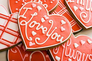 valentine's day cookies are arranged in the shape of heart - shaped cutouts