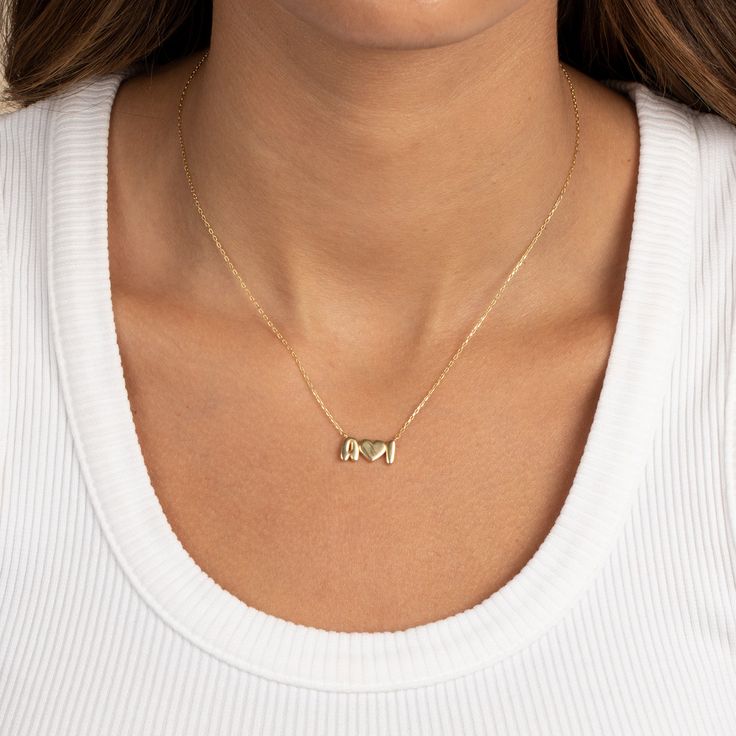 Enhance your look with the Adina Eden Solid Double Initial X Heart Necklace. Crafted from sterling silver and adorned with a radiant gold plating, this necklace exudes elegance. Featuring a nameplate size of 6mm and showcasing two initials, it adds a personalized touch to your ensemble. With a length of 15" plus a 2" extender, it offers a perfect fit for any occasion. Elevate your style with this charming piece that beautifully combines sophistication and sentiment. Product Details Made from Ste Elegant Engraved Nameplate Initial Necklace, Elegant Nameplate Initial Necklace For Anniversary, 14k Gold Initial Pendant Name Necklace For Anniversary, Elegant Gold Initial Necklace With Name Detail, Elegant Gold Initial Necklace With Custom Name, Elegant Sterling Silver Nameplate Initial Necklace, Elegant Nameplate Jewelry With Initials, Elegant Initials Nameplate Jewelry, 14k Gold Initial Pendant Name Necklace For Her