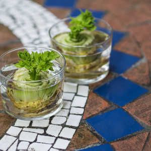 two cups filled with food sitting on top of a tiled floor next to each other