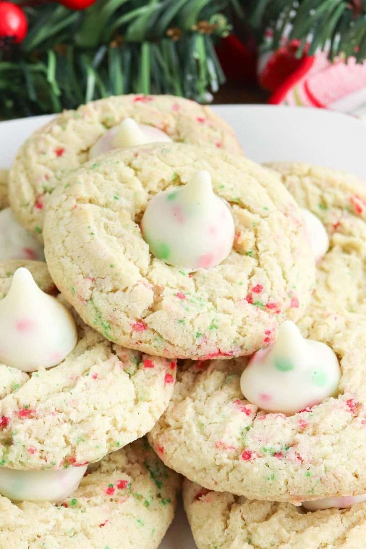 white chocolate peppermint cookies on a plate with candy canes in the middle