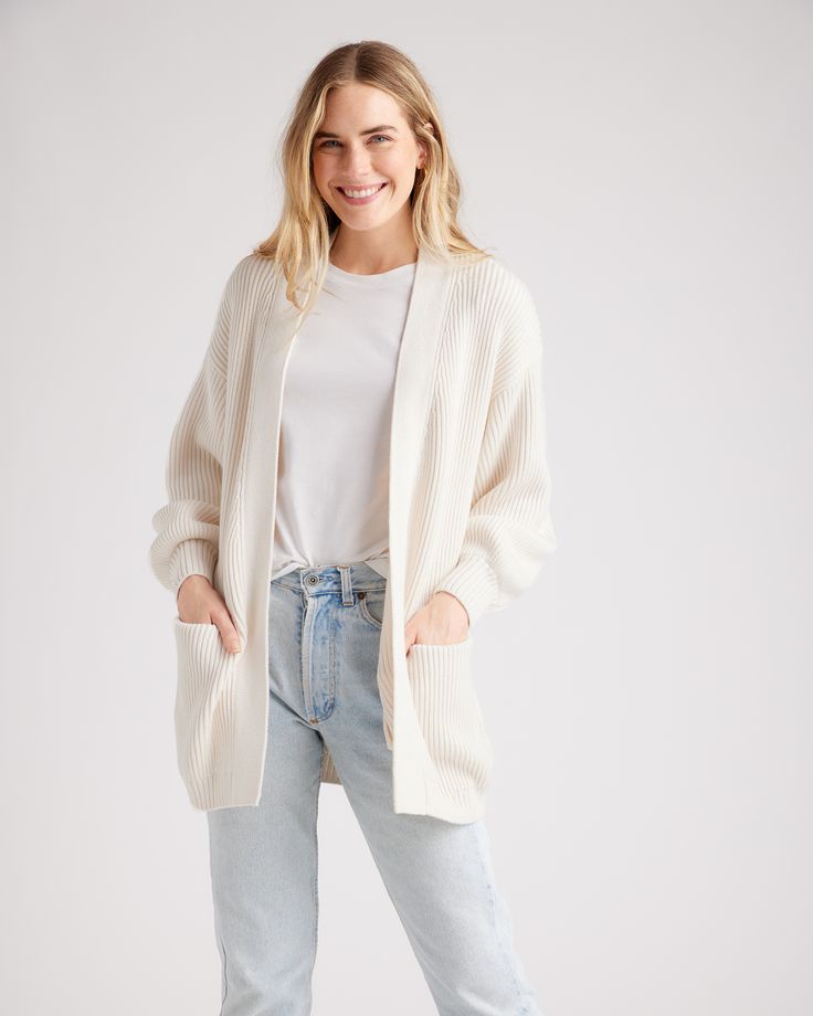 She's giving cozy evenings, busy days, chill vibes. Our fave organic cotton cardigan has dropped shoulders and lantern sleeves for a relaxed look—even if you're running about town. Roomy front pockets add to the coziness and functionality. We made her in a bit of an oversized fit so you can wrap up in soft supple cotton.  | Quince | Women's OverSized Cardigan Sweater in Ivory, Size Small, Organic Cotton Everyday Cream Soft Knit Outerwear, Relaxed Fit Winter Cardigan For Everyday, Relaxed Everyday Winter Cardigan, Relaxed Winter Sweater For Everyday, Oversized Cream Cardigan For Daywear, Winter Relaxed Fit Everyday Cardigan, Winter Cardigan With Relaxed Fit, Winter Relaxed Fit Cardigan, Relaxed Everyday Winter Sweater