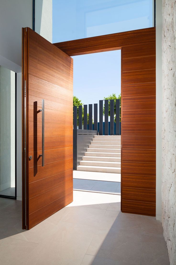 an open wooden door leading to a stairway