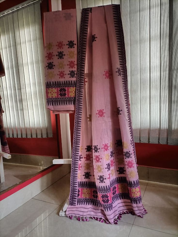 Welcome to our shop, where we take pride in offering you the finest craftsmanship and exquisite textiles. Introducing our pure Muga silk Mekhela Chador, a timeless masterpiece that beautifully combines tradition and elegance. Handwoven with care and precision, this Mekhela Chador is crafted from pure Muga silk, sourced from the silkworm Antheraea assamensis, which is indigenous to Assam, India. Muga silk is known for its lustrous golden hue, unparalleled sheen, and incredible durability. It is c Traditional Pink Cotton Silk Unstitched Suit, Cotton Kurta With Woven Motifs For Traditional Ceremonies, Traditional Ceremonies Woven Motifs Blouse Piece, Cotton Traditional Wear With Woven Motifs For Ceremonies, Traditional Kurta With Woven Motifs, Traditional Pink Slub Silk Salwar Kameez, Unstitched Chanderi Handloom Blouse Piece, Semi-stitched Woven Motifs Dupatta For Diwali, Bohemian Chanderi Dupatta With Zari Weaving