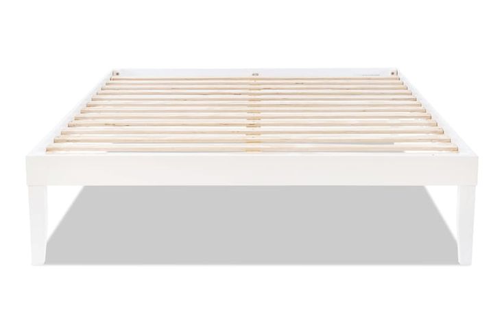 a white bed frame with wooden slats on the bottom and foot board, in front of a white background