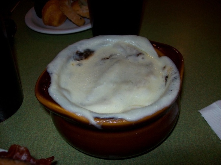 a bowl filled with whipped cream on top of a table