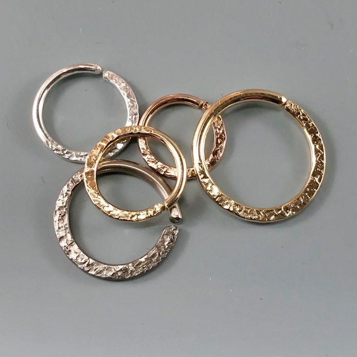 16 GAUGE - SEPTUM RING JEWELRY - select your metal type in the drop down menu - choices are * 14kt rose gold filled, *12kt yellow gold filled, *sterling silver *niobium *argentium sterling - choose your ring size from 6mm to 16mm - OUTSIDE or INSIDE diameter options in drop down menu -16 gauge wire - 1.3mm - for larger holes -NOTE these are strong rings due to the thickness of the wire and their size -the bottom half of the ring is flattened and textured to add dimension and a bit of flash -you Small Hoop Rose Gold Rings For Anniversary, Hypoallergenic Round Septum Ring For Anniversary, Small Hoop Gold Rings For Anniversary, Gold Small Hoop Rings For Anniversary, Nickel Free Yellow Gold Wedding Ring, Small Hoop White Gold Rings For Gift, White Gold Small Hoop Rings As Gift, Minimalist Etched Round Ring, Nickel Free White Gold Hoop Ring