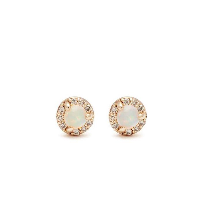 Details 3mm opal center, 0.058ct champagne diamond pavé halo set in recycled 14k rose or yellow gold. Sold as a pair. Earring diameter: 4.65mm Each opal and diamond is unique and may vary in shade and appearance from what is depicted on the site. Description Tiny champagne diamonds encircle an inverted set opal gem center in these fiercely feminine studs, named for their counterparts in the Rosette collection. Earring on model for illustrative purposes only. She wears the champagne diamond Tiny 14k Rose Gold Halo Earrings, Fiercely Feminine, Halo Setting, Tiny Stud Earrings, Champagne Diamond, Stud Earring, Pave Diamonds, Halo, Champagne