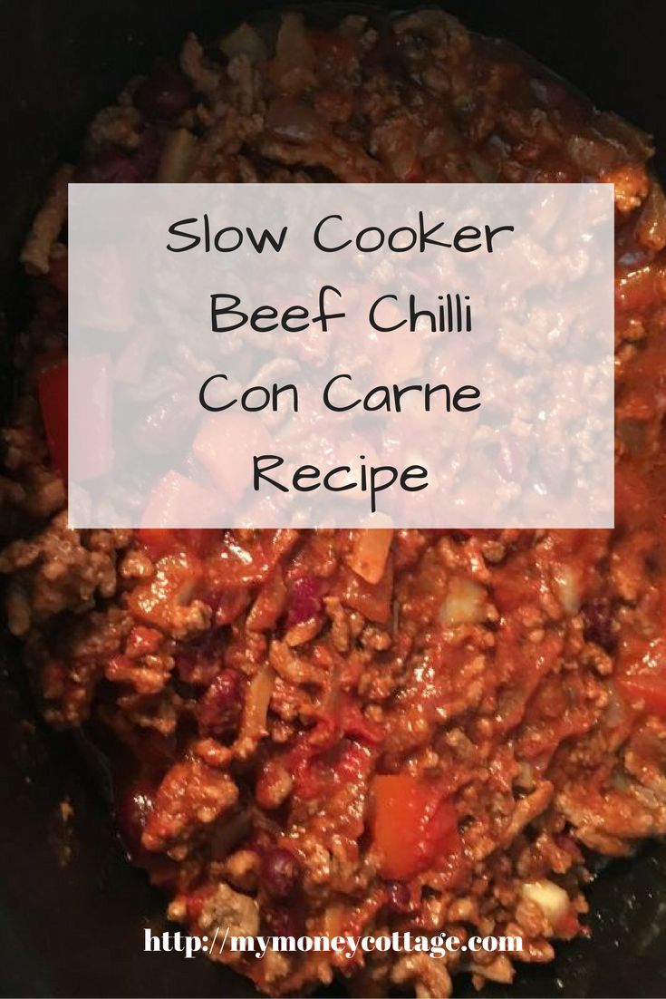 slow cooker beef chilli con carne recipe in a black skillet with text overlay