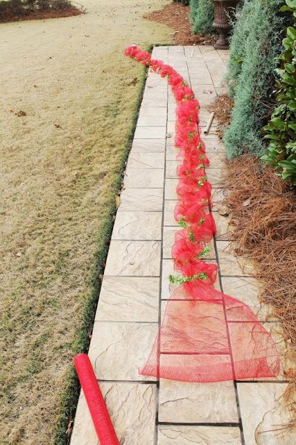 a long red piece of cloth on the ground