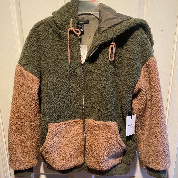 Olive/Taupe Hooded Jacket Never Worn - Brand New With Tags Hand Wash Cold/Line Dry Trendy Fleece Jacket For Cold Weather, Trendy Fleece Outerwear With Cozy Fit, Trendy Hooded Fleece Jacket, Trendy Cozy Fit Fleece Outerwear, Forever 21 Hooded Fall Outerwear, Forever 21 Hooded Outerwear For Fall, Hooded Forever 21 Outerwear For Fall, Sherpa Hoodie For Cold Weather In Fall, Fall Sherpa Hoodie For Cold Weather