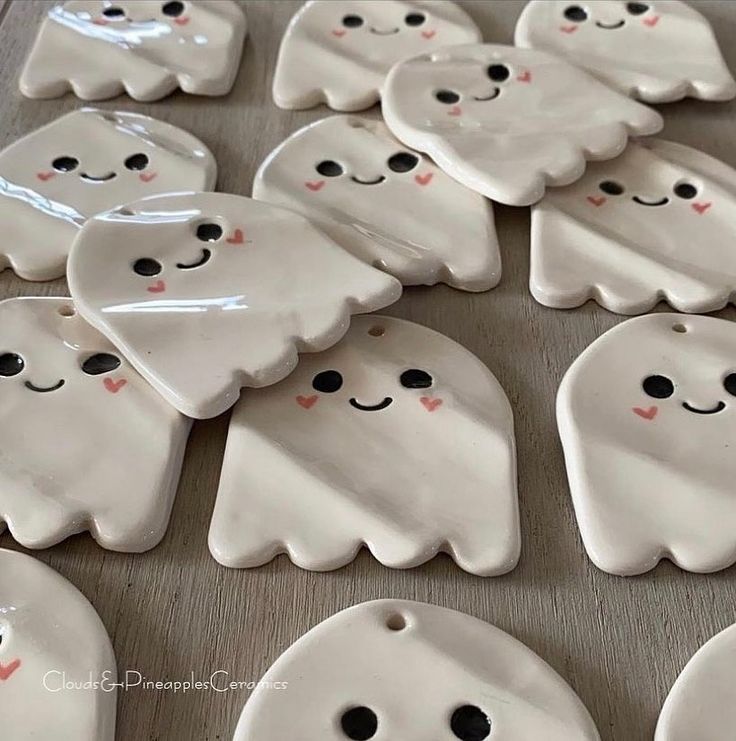 some white ghost cookies are sitting on a table