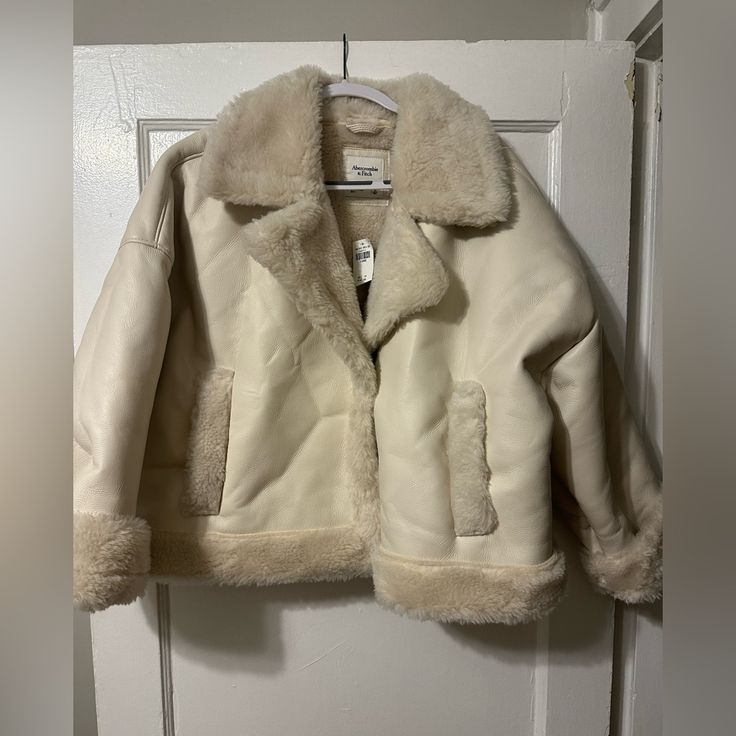 Abercrombie Cream Leather And Fur Winter Coat. 2 Button Snap To Close. Xl And Nwt. Such A Warm, Gorgeous Jacket For Winter. I Want To Keep It It’s Just Too Big On Me White Winter Outerwear With Double Button Closure, Cream Outerwear With Double Button Closure For Fall, Cream Outerwear With Double Button Closure And Lapel Collar, Winter Cream Blazer With Double Button Closure, Winter White Outerwear With Button Closure For Work, Collared Winter White Outerwear For Work, White Cold Weather Outerwear With Button Closure, Winter White Buttoned Outerwear For Fall, Winter White Single Breasted Outerwear With Lapel Collar