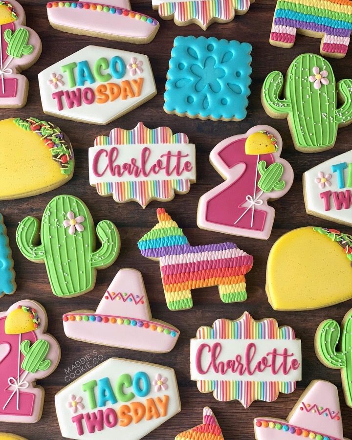 some decorated cookies are sitting on a table