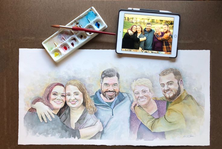 an image of some people on a table with watercolors and paintbrushes