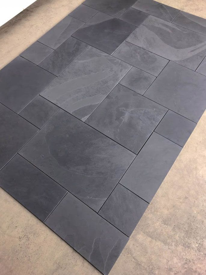 a large gray tile floor in a room