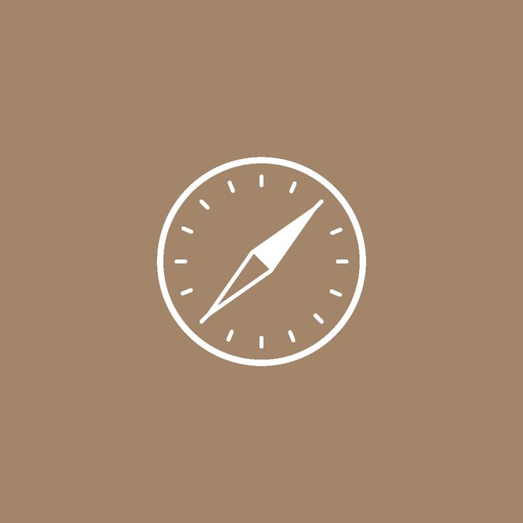 a white compass icon on a brown background