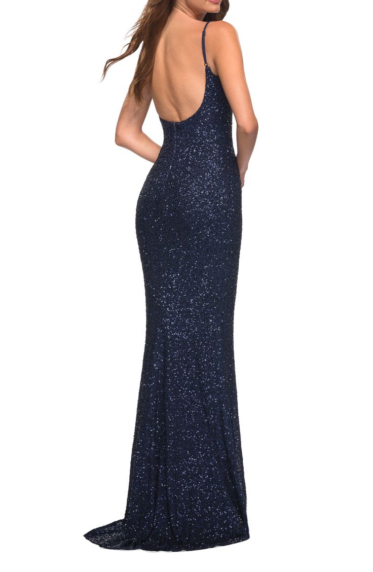 Iridescent sequins create a play of shimmering texture down the slinky length of an open-back gown sure to make a stunning statement. 60" length Scoop neck Adjustable straps Lined 100% polyester Spot clean Imported Sparkling Backless Evening Dress, Navy Blue Sparkly Dress, Blue Sparkly Dress, Navy Prom Dresses, Sparkly Prom Dress, Plastic Dress, Sequin Formal Dress, Trumpet Gown, Prom Dress Stores