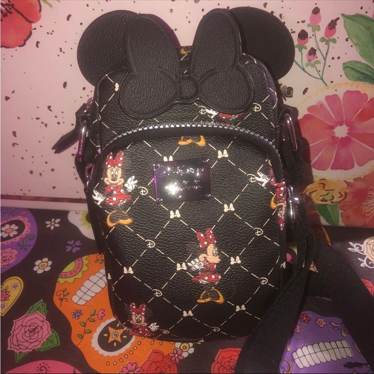 Disney Limited Edtion Black Crossbody Purse. Black Quilted Faux Leather Featuring Minnie Mouse Gold All Over. This Bag Is What They Call A Phone Crossbody. It’s Big Enough For Your Iphone And Your Essentials. Amazing For Going To Concerts. Keep Hold Of Those All-Important Small Accoutrements With Our Minnie Mouse Purse. Benefiting From A Double Pouch Design, It’s Ideal For Accommodating Essentials Such As Phones And Money, Making It A Must Have Accessory For Fun Days Out With Friends! Sporting M Minnie Mouse Bags For Disney Trips, Black Mickey Mouse Bag For Disney Fan Events, Black Minnie Mouse Bag For Disney Trips, Black Minnie Mouse Bag For Everyday Use, Trendy Black Minnie Mouse Bag, Disney Bags, Disney Minnie Mouse Bag, Cute Black Mickey Mouse Bags, Cheap Black Minnie Mouse Bag