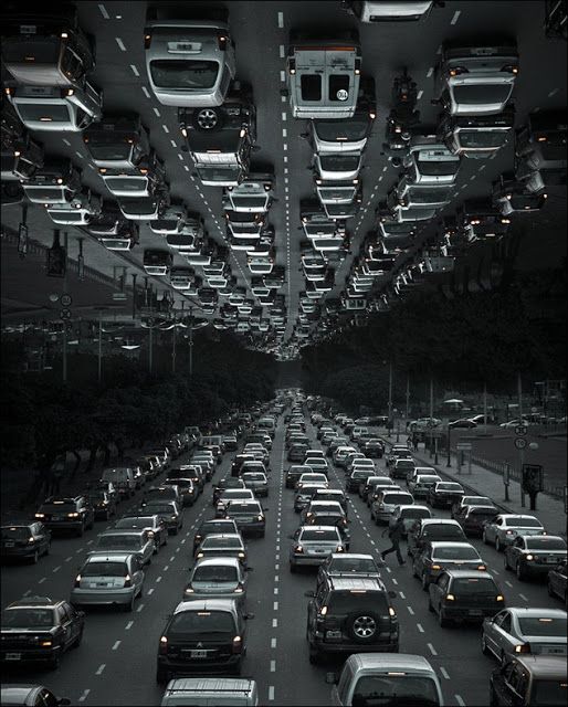 a large group of cars driving down a highway