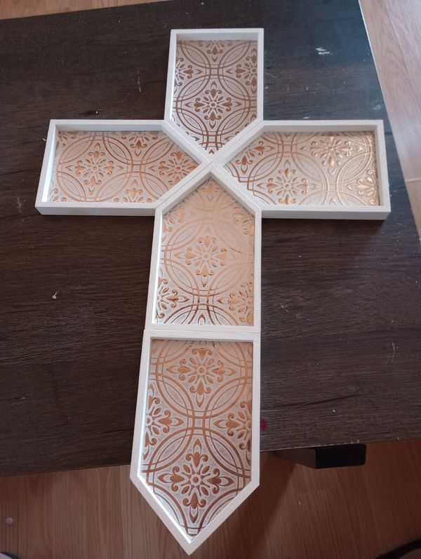 a wooden cross sitting on top of a table