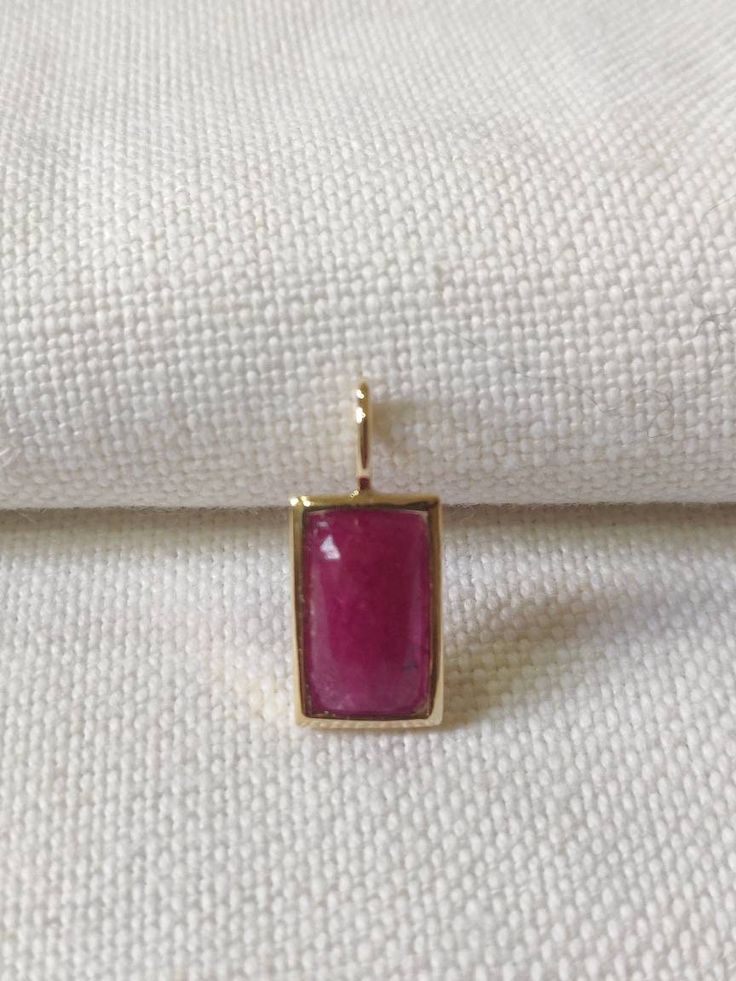 This stunning Pendant is set in 14k Solid Yellow Gold with Natural Ruby with utmost precision. It is a unique gemstone Pendant for nearly every occasion and is completely hassle-free jewelry. ITEM DETAILS: *  GEM: Ruby * GEM SIZE: 7X13mm * GEM SHAPE: Octagon * Gem weight: 3.88 carats * Gold Purity: 14KT (58.33% approx.) * Gold Weight: 1.5 gram * Total Weight of the Pendant: 2.27 gram The Gold purity is guaranteed and it comes with authentic 14KT gold hallmark. Since my items are handmade, they a Elegant Jewelry With Bezel Setting Rectangular Pendant, Luxury Rectangular Gemstone Pendant Jewelry, Fine Jewelry With Rectangular Gemstone Accents, Fine Jewelry With Gemstone Accents Rectangular Shape, Elegant Jewelry With Rectangular Pendant And Natural Stones, Yellow Gold Faceted Jewelry With Rectangular Stone, Yellow Gold Jewelry With Faceted Rectangular Stone, Luxury Jewelry With Rectangular Gemstone Accents, Fine Jewelry With Rectangular Birthstone