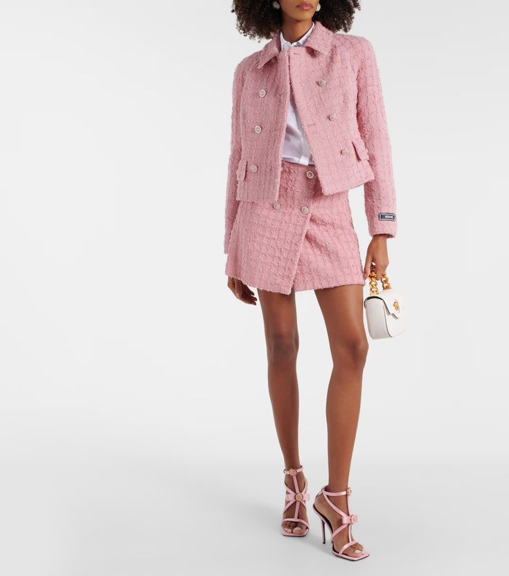 Wool-blend bouclé miniskirt in pink - Versace | Mytheresa Luxury Mini Skirt For Workwear, Chic Tweed Skirt With Button Closure, Tweed Skirt With Button Closure For Workwear, Chic Wool Mini Skirt For Workwear, Elegant Winter Mini Skirt With Buttons, Pink Versace, Spring Knits, Pink Tweed, Spring Bags