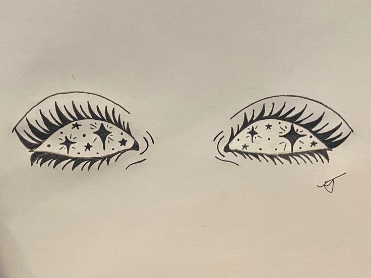 two drawings of eyes with stars on them