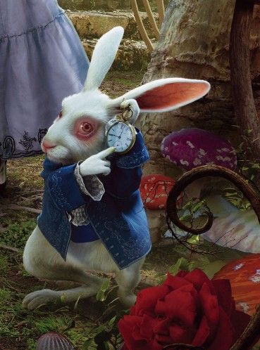 a white rabbit dressed in blue is holding an alarm clock