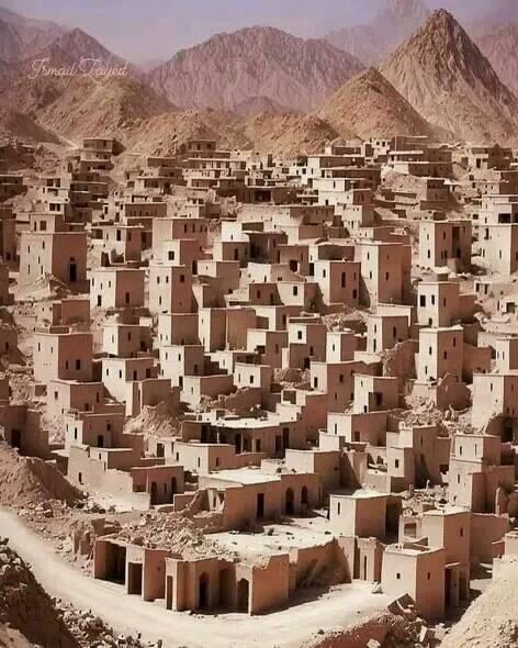 an aerial view of a village in the desert