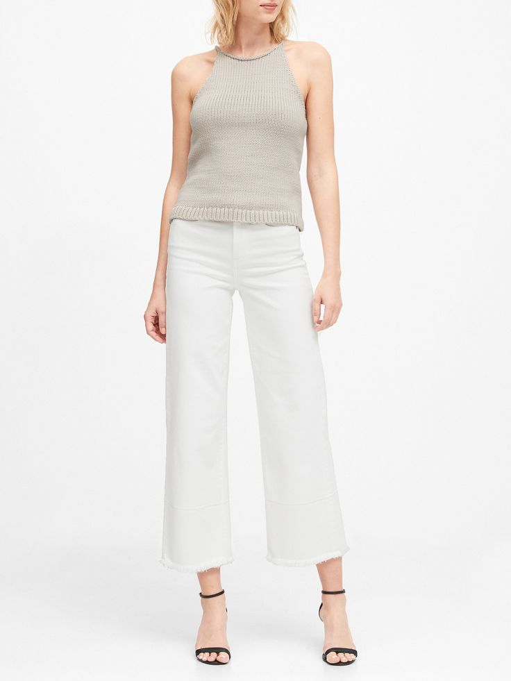 Based on a piece from the Banana Republic archives, this soft, sweater top is knit using a chunky, cotton-rich yarn for an extra-luxe texture.  Halter-style neck.  Straight hem.  Fitted.  Cropped body length - designed for high-rise styles.  Body len Ribbed Cotton Knit Top For Fall, Chic Cotton Turtleneck Top, Chic Neutral Knit Sweater, Chic Relaxed Fit Chunky Knit Top, Chic Cotton Knitted Tops, Winter Cotton Textured Knit Top, Chic Knitted Cotton Tops, Chunky Knit Turtleneck Top, Chic Cotton Knit Sweater