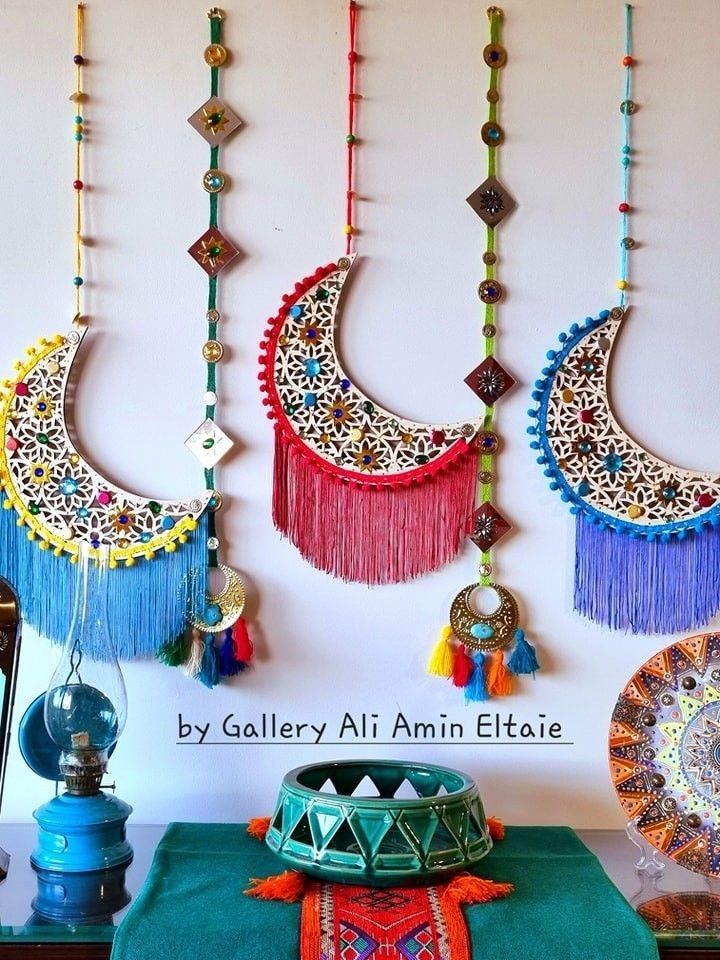 there are many colorful necklaces hanging on the wall