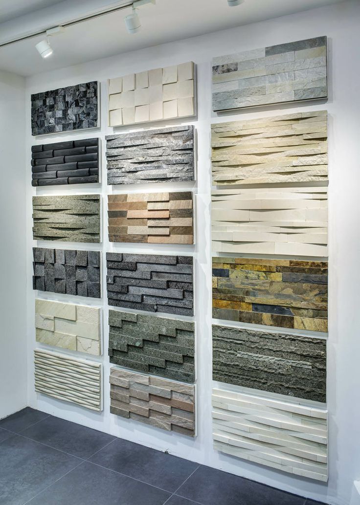 a wall that has different types of tile on it and some are stacked up against each other