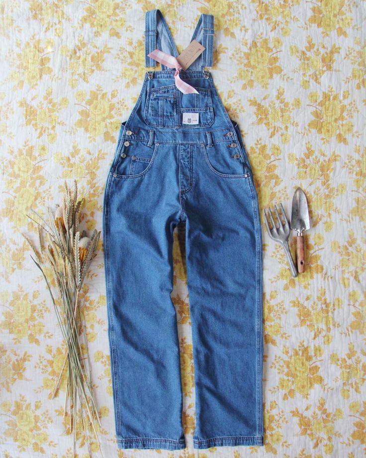 The perfect overalls for any task. Soft brushed denim pairs with a vintage 90's fit, traditional overall design & stitch detailing. Sure to be your favorite overalls yet! Easy fit. Color: Denim 100% Cotton Hand or machine wash cold X-Small: Bust Open, Waist 30", Hips 40", Inseam 30"Small: Bust Open, Waist 32", Hips 41", Inseam 30"Medium: Bust Open, Waist 33" Hips 42" Inseam 30.5"Large: Bust Open, Waist 34", Hips 43", Inseam 31"X-Large: Bust Open, Waist 35", Hips 44", Inseam 32" Medium Wash Relaxed Fit Bib Front Jeans, Retro Dark Wash Cotton Denim Jumpsuit, Relaxed Fit Bib Front Denim Jeans, Relaxed Fit Denim Jeans With Bib Front, Utility Style High Rise Medium Wash Overalls, Utility High Rise Medium Wash Overalls, Denim Bib Front Overalls, Fall Medium Wash Bib Front Denim Jumpsuit, Vintage Light Wash Denim Overalls