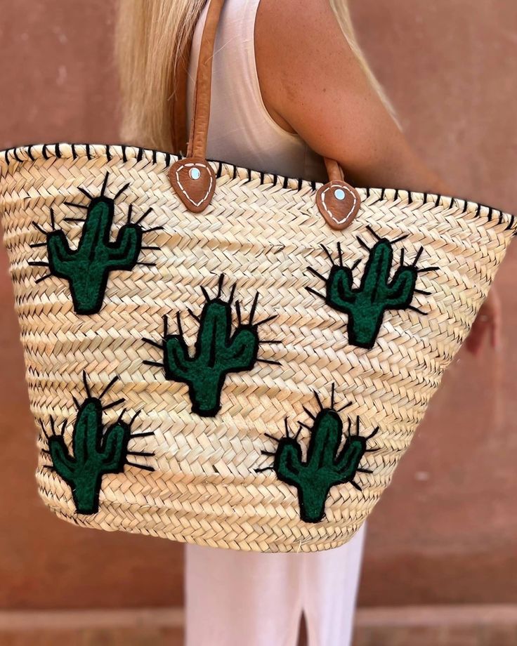 This straw tote is handcrafted in Morocco with love, each is a unique work of art. Perfect for the beach, the market, or wherever your day takes you. Accented with durable, genuine leather straps. Versatile and spacious design. Embroidered cactus design Embroidered Straw Bag For Summer, Embroidered Brown Vacation Bag, Brown Embroidered Vacation Bag, Embroidered Natural Straw Beach Bag, Embroidered Natural Straw Bag For Beach, Embroidered Rectangular Straw Bag For Beach, Embroidered Natural Straw Travel Bag, Artisan Embroidered Beach Bag, Casual Embroidered Straw Tote Bag