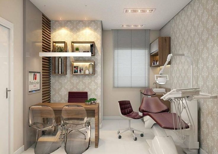 a dental room with chairs, desk and shelves