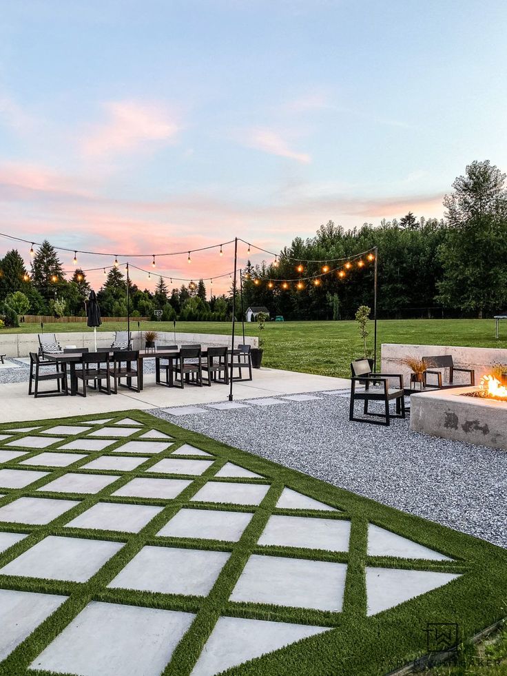 an outdoor dining area with fire pit and seating