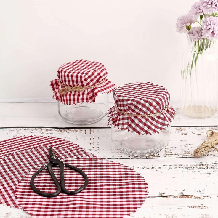 red and white gingham table cloths with scissors on the table next to them