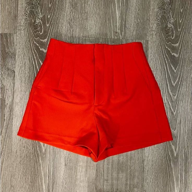 These Shorts Feature A Seamed Detail On The Front And Back, Welt Back Pockets, Front Zipper With Eyelet Hook Closure And A High Waist. Measurements Waist - 13” Rise - 11.5” Length- 4” Color - Orange Size - Xsmall Condition - Nwot Casual Solid Color Shorts For Party, Red High-waisted Shorts For Party, Red High-waisted Shorts For Night Out, Chic Red High-waisted Shorts, Red Short Length Bottoms For Party, Red Party Bottoms In Short Length, Red Party Bottoms Of Short Length, Zara Party Bottoms With Short Length, Chic Stretch Red Shorts